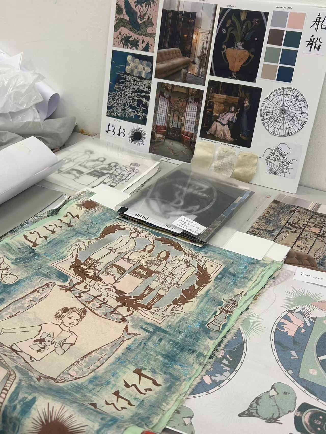 Shirley's textile desk with drawings, fabric samples and research